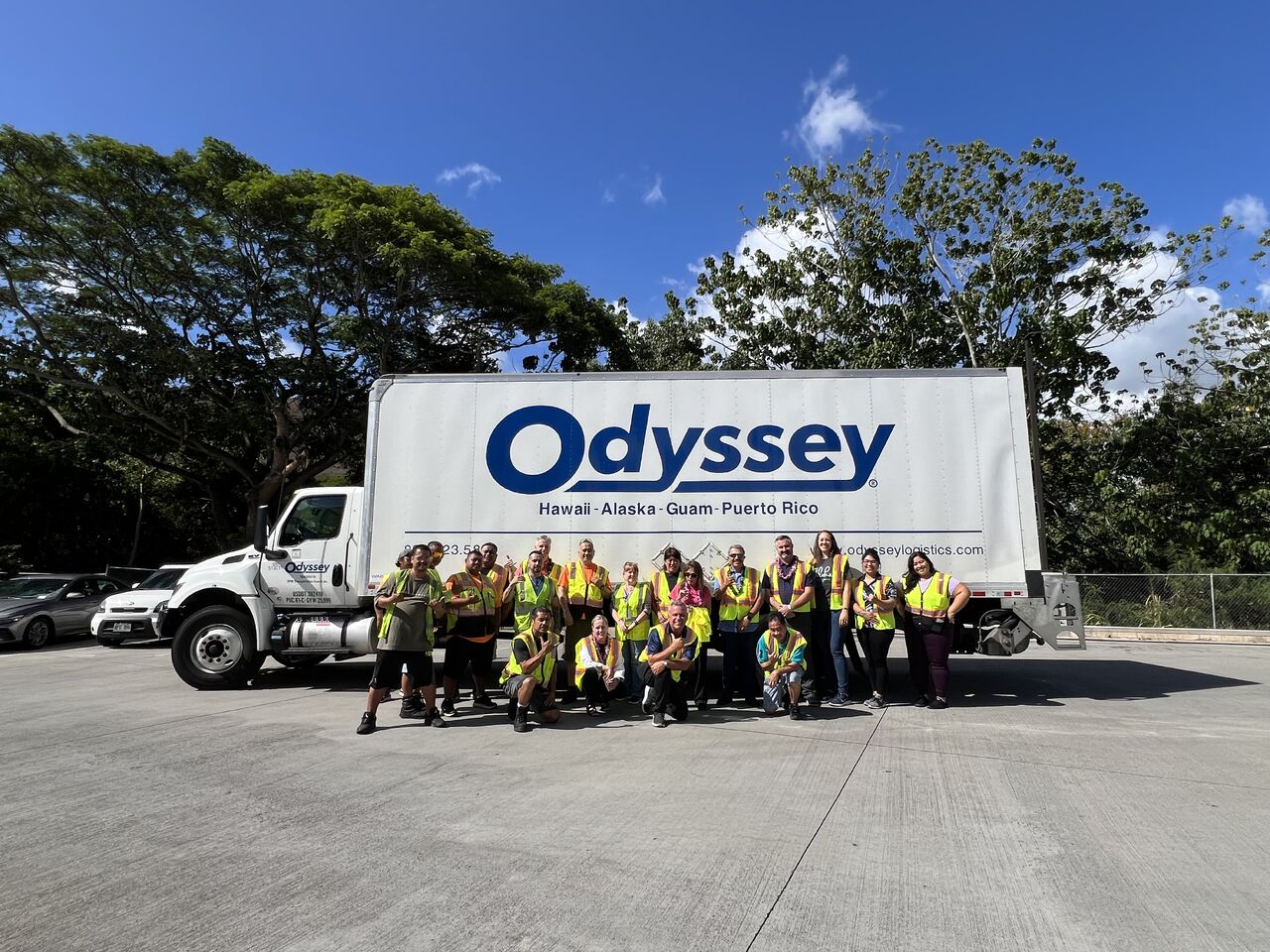 Odyssey team members in Hawaii standing by an Odyssey truck